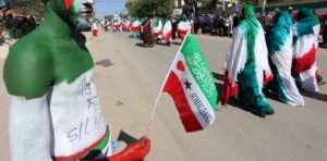 A man with body paint in the colours of the national flag participates in a street parade to celebrate the 24th self-declared independence day for the breakaway Somaliland nation from Somalia in capital Hargeysa